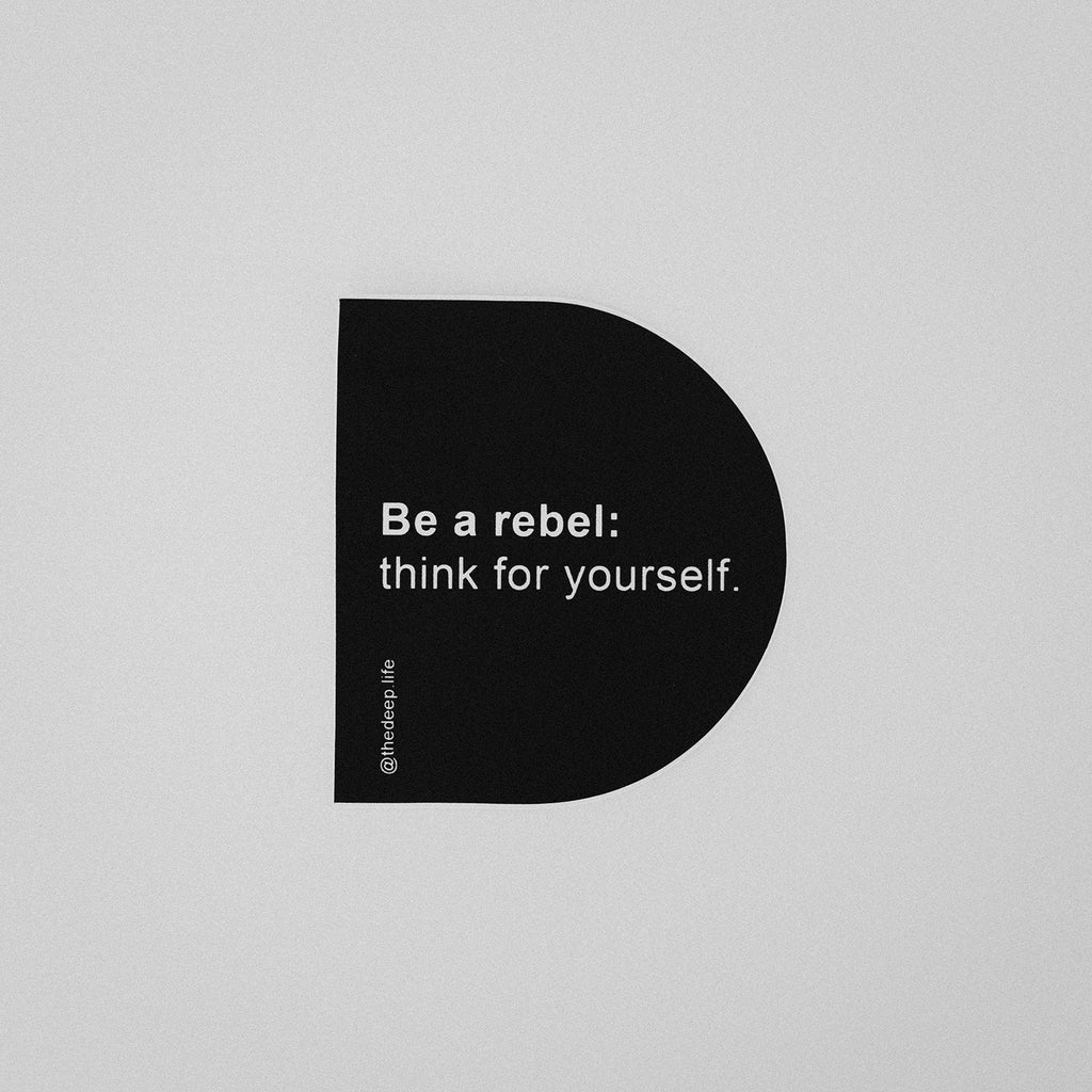 Sticker in the shape of a D that reads: Be a rebel: think for yourself